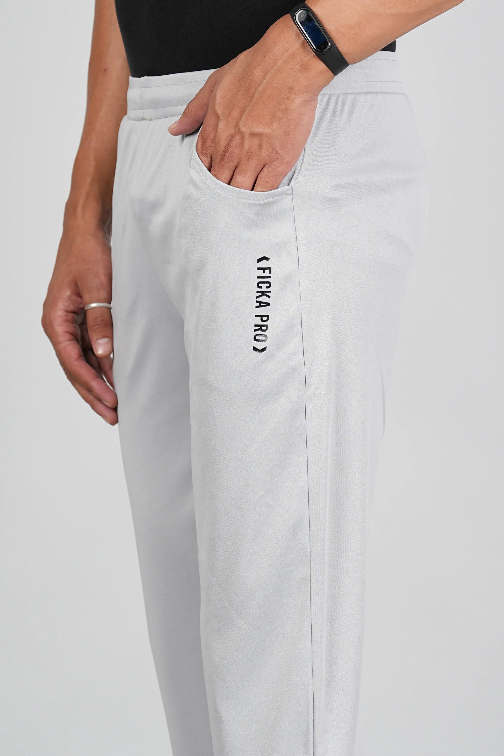 Light grey sports trackpant fabric close-up showing soft breathable material