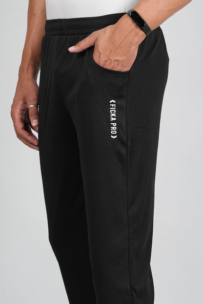 Black trackpant fabric close-up showing soft breathable material