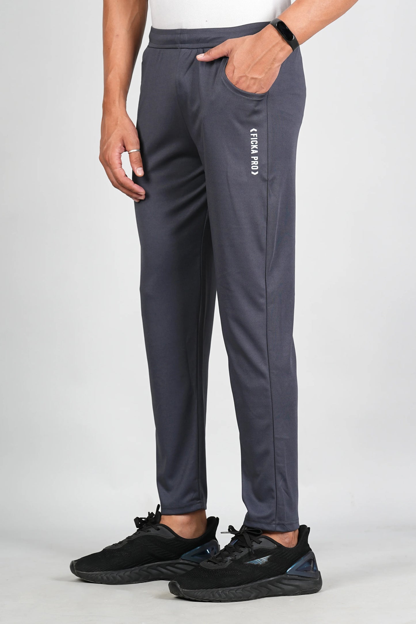 Dark grey sports trackpant for men side view showing elastic waistband
