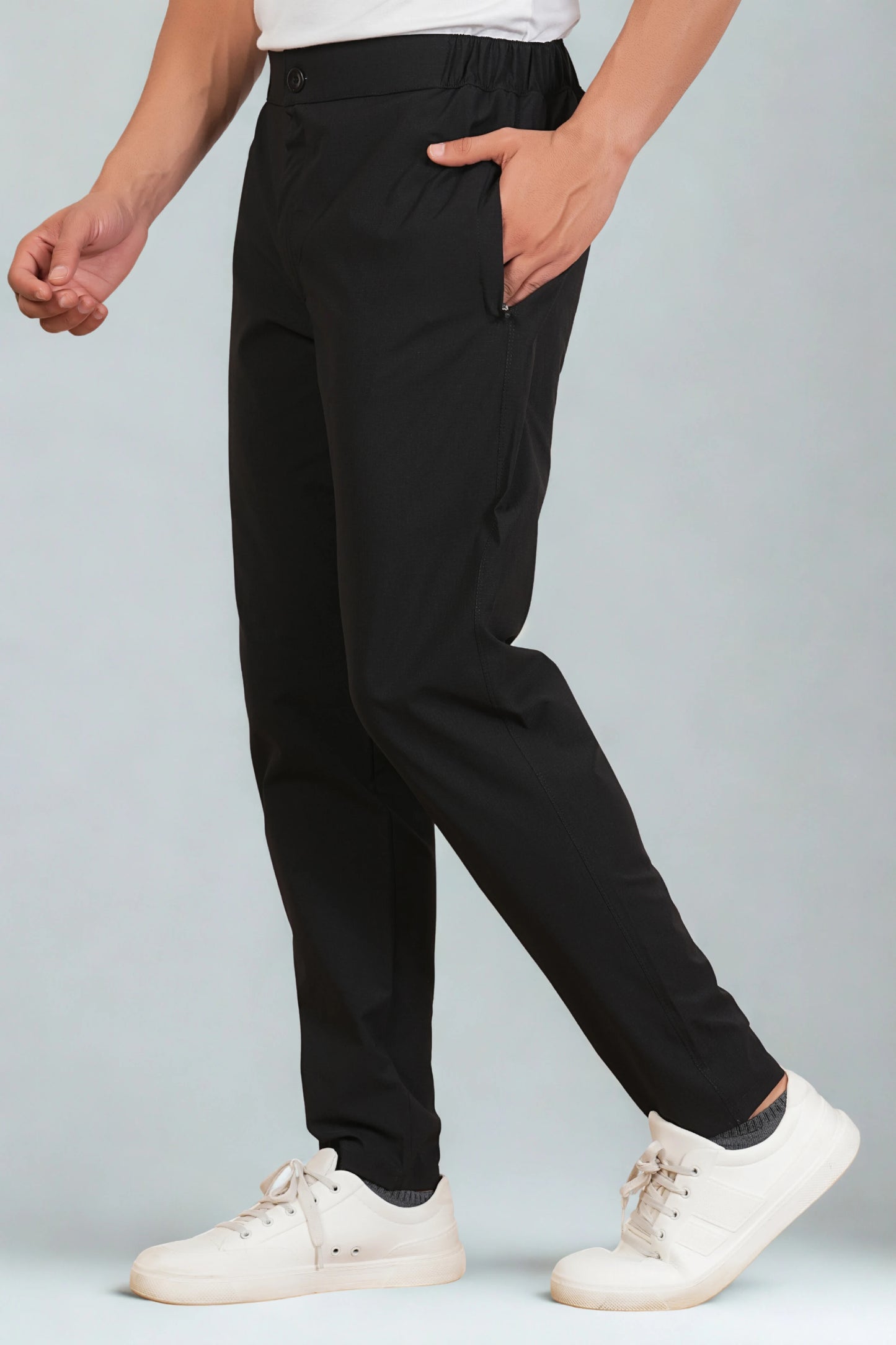 Men’s black button pant side view showing smart pant style fit